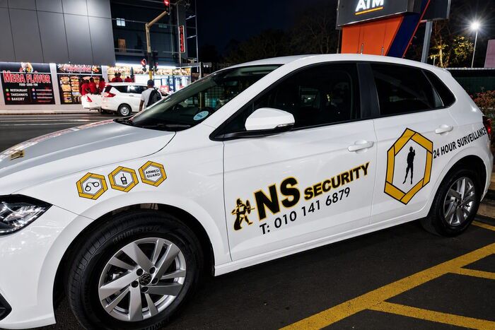 Close-up of an NS Security branded patrol vehicle
