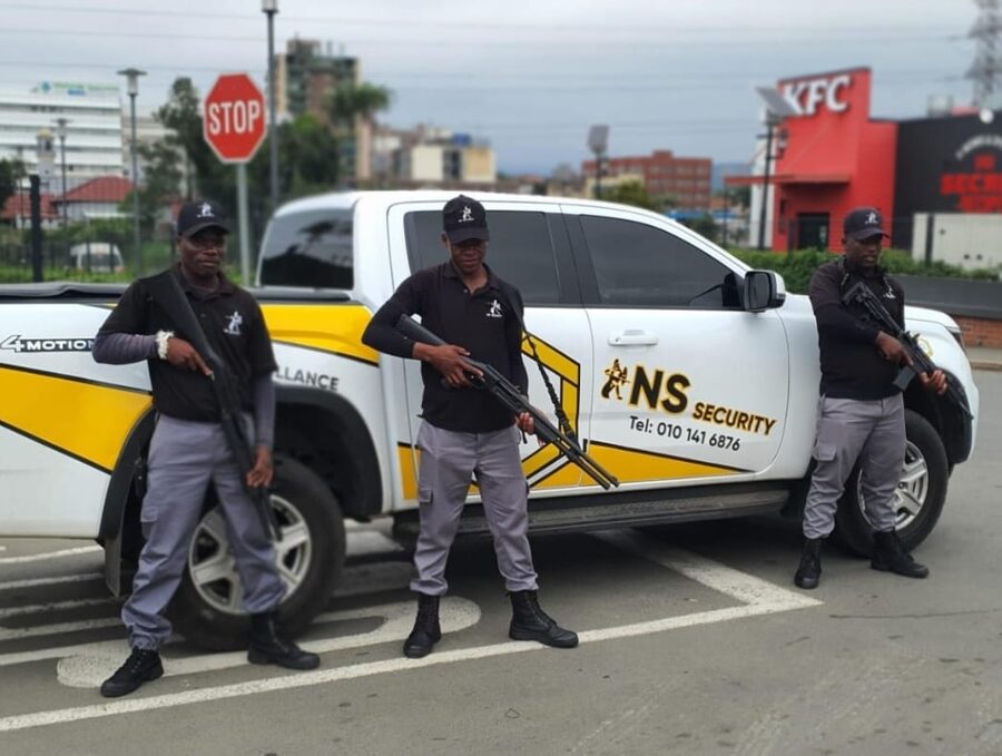 NS Security armed response officers with branded response vehicle